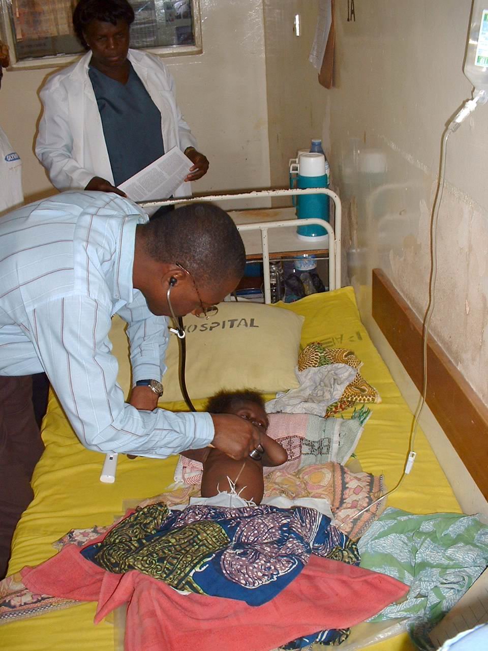 Nigerian doctor on rounds attending to patients in Nigeria